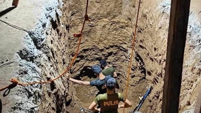 Police inside excavated tunnel